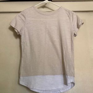 A beige cream colored high-low top.